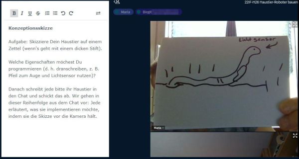Haustier Regenwurm Aufgabenbeschreibung und Haustier Regenwurm auf Papier, in die Zoom-Kamera gehalten